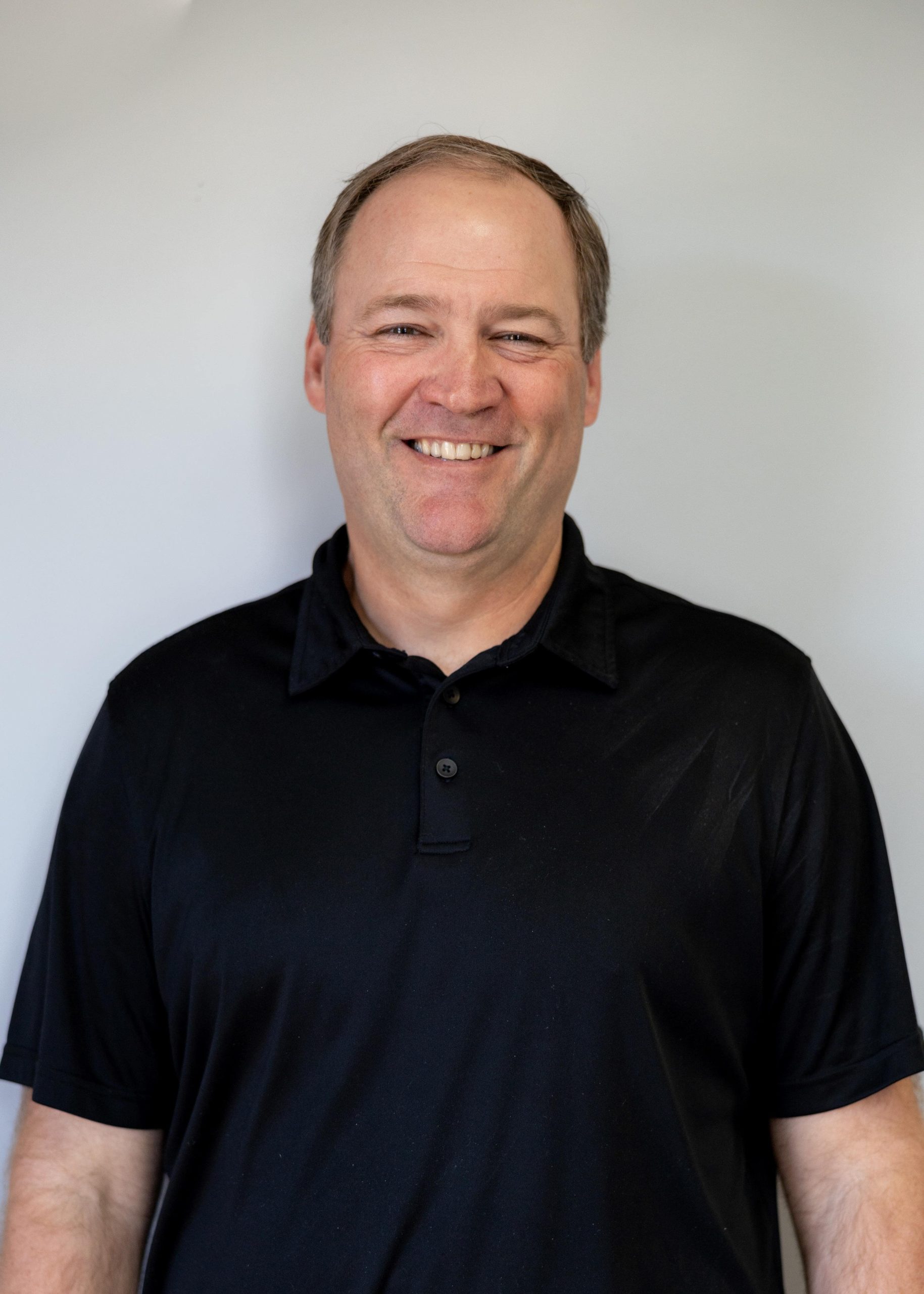 Headshot of an adult male physical therapist